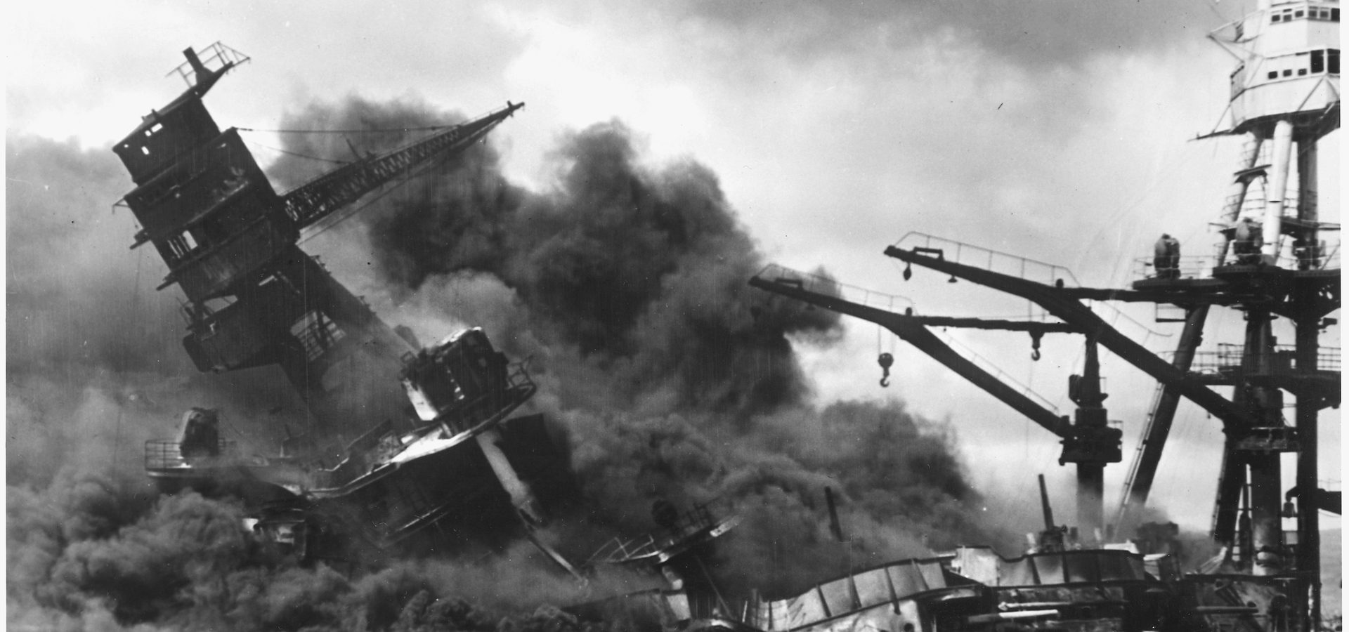 The USS Arizona burning and sinking at Pearl Harbor on December 7, 1941